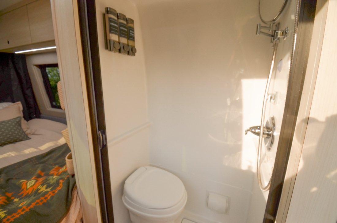 Enclosed wet bath with toilet and shower