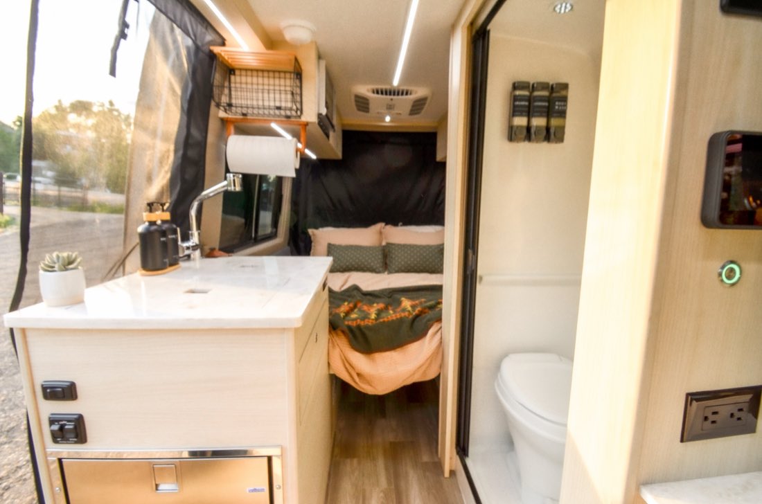 Galley with induction cooktop, refrigerator and switch panel