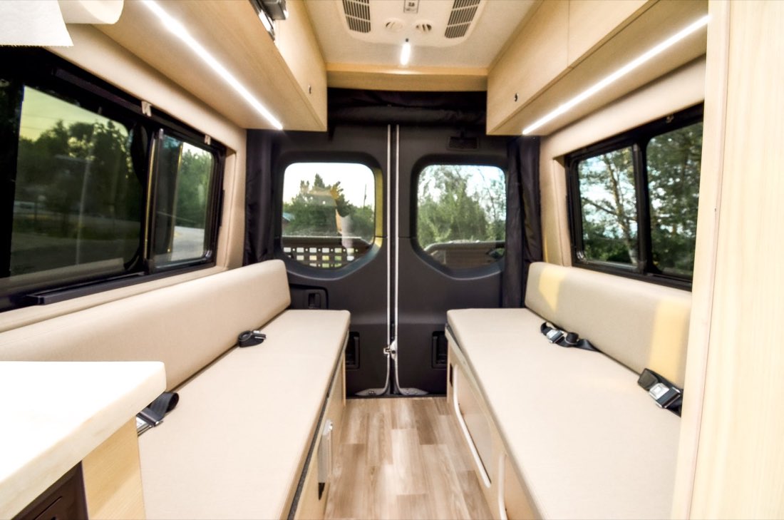 Facing bench sofas with seatbelts in day configuration